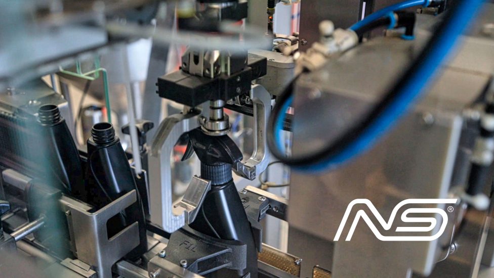 Production line: machine fitting spray triggers onto bottles